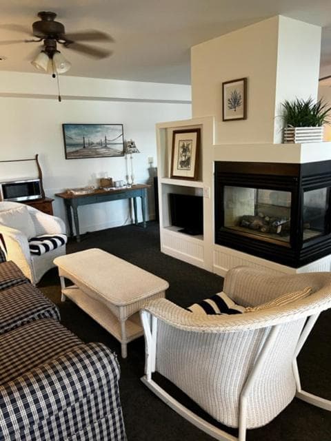The Cottage Suite sitting area by the double-sided fireplace