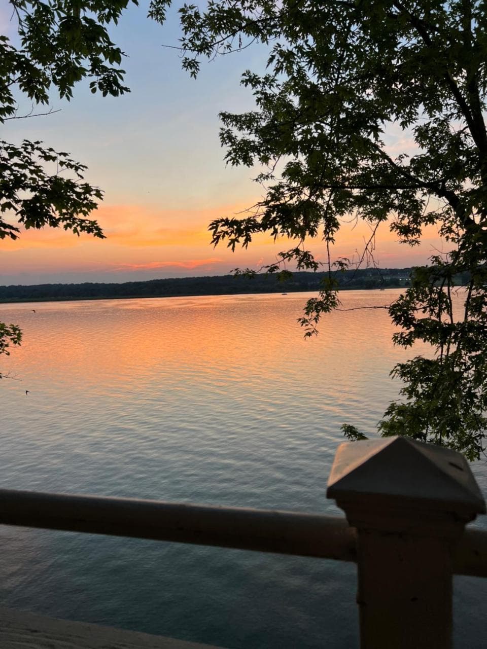Sunset over the lake from the porch rail