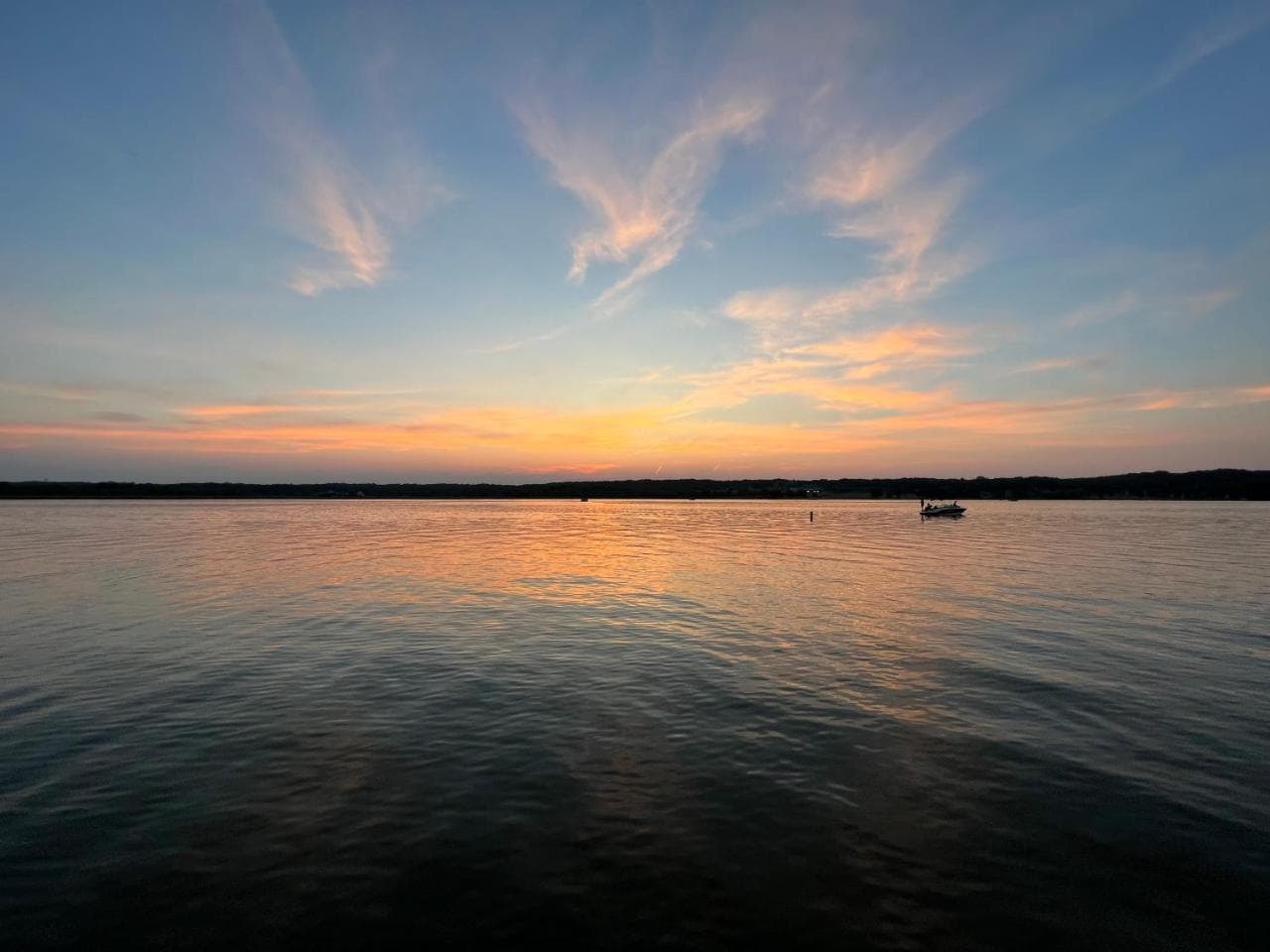 A wide sunset over calm water